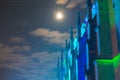 detail view of ancient roman catholic basilica in germany at night with cloudy sky and full moon Royalty Free Stock Photo