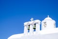 Detail view of bells and roof of traditional Greek cycladic chur Royalty Free Stock Photo