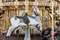 detail view of a classic and historic merry-go-round carousel with a horse and race car Royalty Free Stock Photo