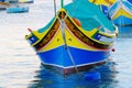 Detail view of the colorful boat luzzi with Eye of Osiris in Marsaxlokk, Malta