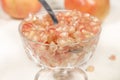 Detail view of crystal goblet full of white pomegranate grains