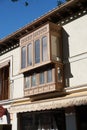 Street view in Toledo showing enclosed balcony in timber