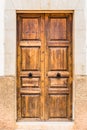 Elegant old wooden front door of old mediterranean villa Royalty Free Stock Photo