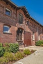 Detail view of an old farm. The facade is made of brick.