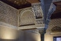 Detail view at the ornamented column and walls, on Mexuar hall courtroom, inside the Nasrid Palaces, Alhambra citadel, Granada, Royalty Free Stock Photo