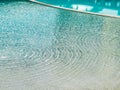 Detail view from the shore of a swimming pool Royalty Free Stock Photo