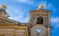 Detail view on St. Mary`s Parish Church in Dingli. Old, historic and authentic christian chapel with nice blue couple and tower