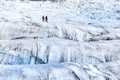 Detail view of two trekkers walking on the glacier, Vatnajokull Royalty Free Stock Photo