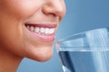 Detail view of a woman female drinking a glass of water. Detail view of a young pretty female drinking a glass of water. Royalty Free Stock Photo