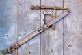 Detail of a vintage door with a rusty metal lock Royalty Free Stock Photo