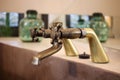 Detail of a vintage faucet placed in the bathroom of a luxury room in a country cottage hotel close to Girona, Catalonia, Spain Royalty Free Stock Photo
