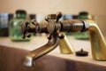 Detail of a vintage faucet placed in the bathroom of a luxury room in a country cottage hotel close to Girona, Catalonia, Spain