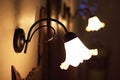 Detail of vintage lamps placed over a bed of a luxury room in a country cottage hotel close to Girona, Catalonia, Spain Royalty Free Stock Photo