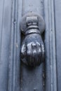 Detail of vintage metal front door fist knocking knob