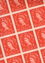 Detail from a sheet of half pence vintage mint postage stamps from the UK.