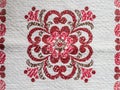 Detail of vintage red and white kitchen linen with floral design Royalty Free Stock Photo