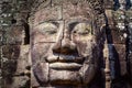 Detail of vintage stone face in the Bayan temple at Angkor Wat Royalty Free Stock Photo