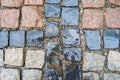 Detail of a vintage traditional wet color stone pavement Royalty Free Stock Photo