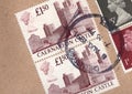 Detail of vintage Uk postage stamps on a brown envelope.