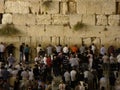 Detail of the Wailing Wall full of faithful praying in the old city of Jerusalem, Israel Royalty Free Stock Photo