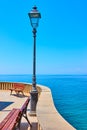 Detail of waterfront with retro street light in Camogli