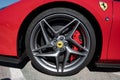 Detail of the wheel of the impressive red Italian Ferrari F8 Tributo sports car.