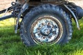 Detail of the wheel of an old caravan and drawbar