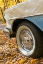 Detail of wheels of baby blue classic car on an autumn day Royalty Free Stock Photo