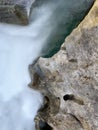 detail of a whirlpool of a mountain river rapids flowing between rocks, abstraction in nature, long exposure, silk effect Royalty Free Stock Photo