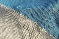 Detail of white and blue fishing net Royalty Free Stock Photo