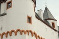 Detail of a white medieval castle with a black roof Royalty Free Stock Photo