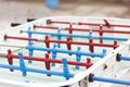 Detail of a white table soccer, foosball, with red and blue players Royalty Free Stock Photo