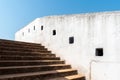 Detail of the white walls and steps leading up to the ancient watch tower