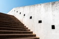 Detail of the white walls and steps leading up to the ancient watch tower