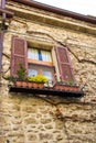 Detail of a window in old building in a beautiful alley of San m