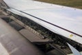 Detail of the wing of an airplane with flaps in motion