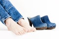 detail of woman and denim clogs