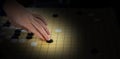 woman hand playing chinese boardgame