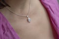 woman neckline wearing moon stone mineral stone pendant on silver chain