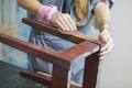 detail of woman restoring furniture