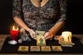 Detail Of A Woman`s Hands Placing Tarot Cards On A Black Card Table