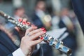 Detail of woman\'s hands playing transverse flute