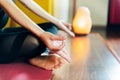 Detail of woman`s hands in relaxation yoga position