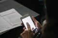 Detail of a woman`s hands using a mobile phone Royalty Free Stock Photo