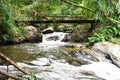 Wood bridge over Chae Son waterfall in Chae Son National Park in Lampang Province, Thailand