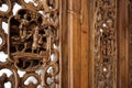 Detail of wooden asian wall decoration with characters, luxury home design