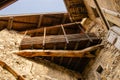 Detail of a wooden balcony built from natural materials in a historic building in Italy. Royalty Free Stock Photo