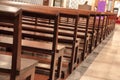 Detail of wooden benches inside a church