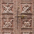 Detail wooden carved door in hindu temple, Kathmandu, Nepal background. Close up Royalty Free Stock Photo