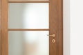 Detail of wooden door in a apartment, frontal view